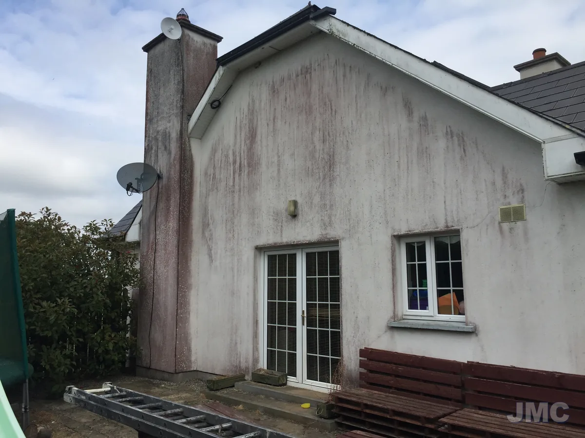 Before: Render and chimney, staining removed