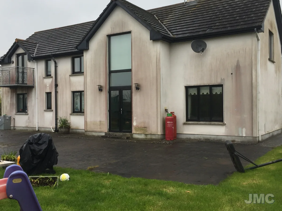 Before: Front elevation softwashed