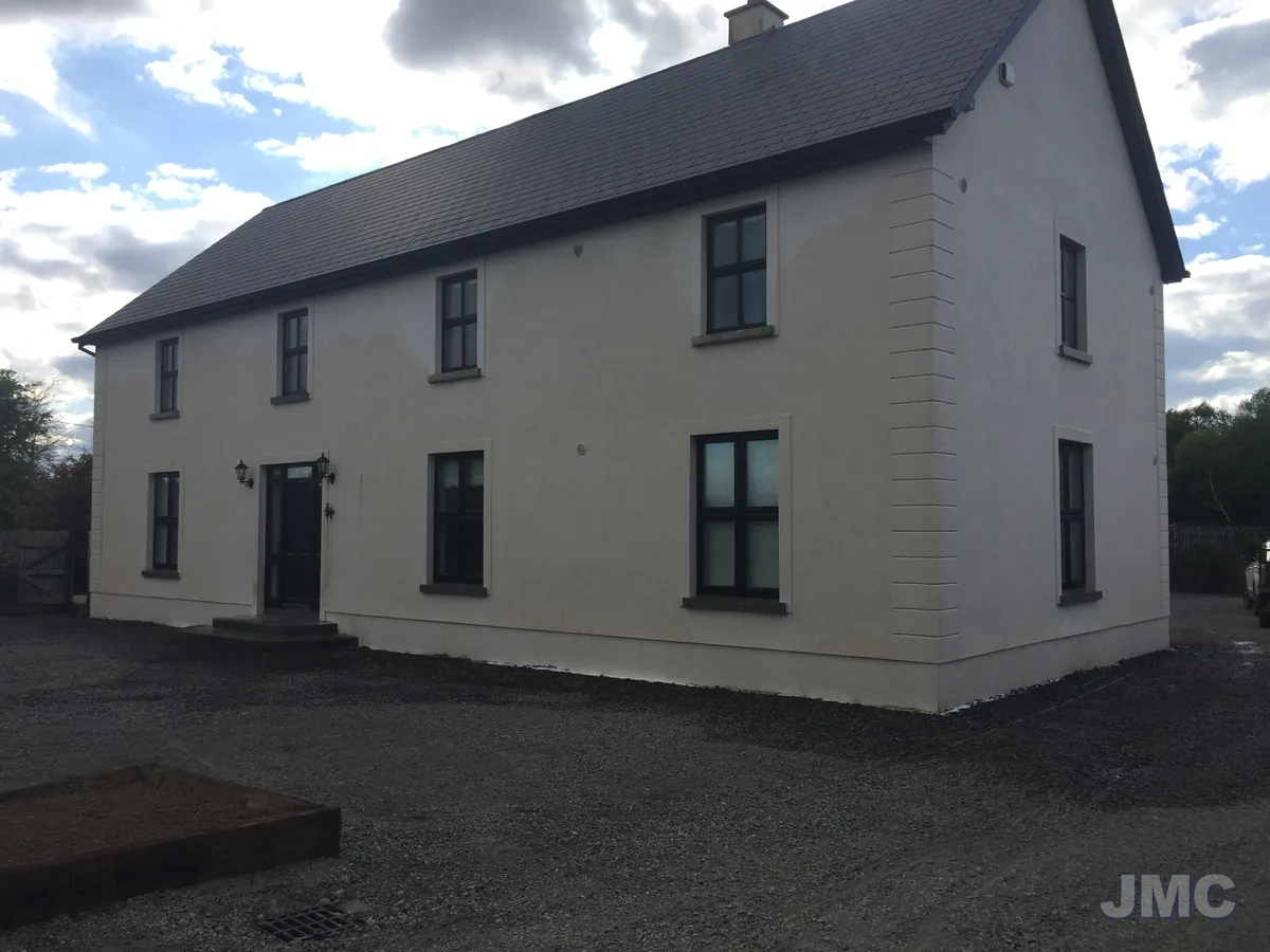 After: Red algae softwashed off a two-storey house