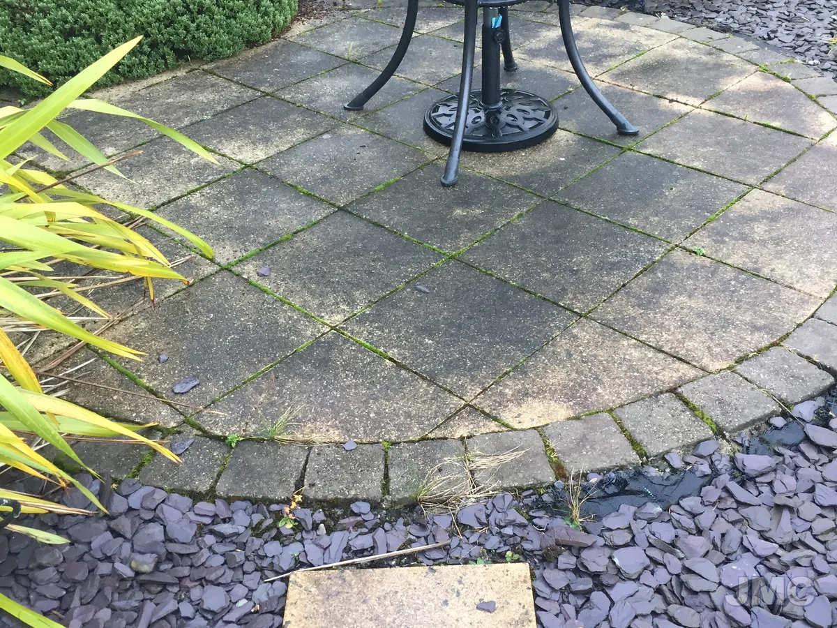 Before: Circular patio, back to the original colour