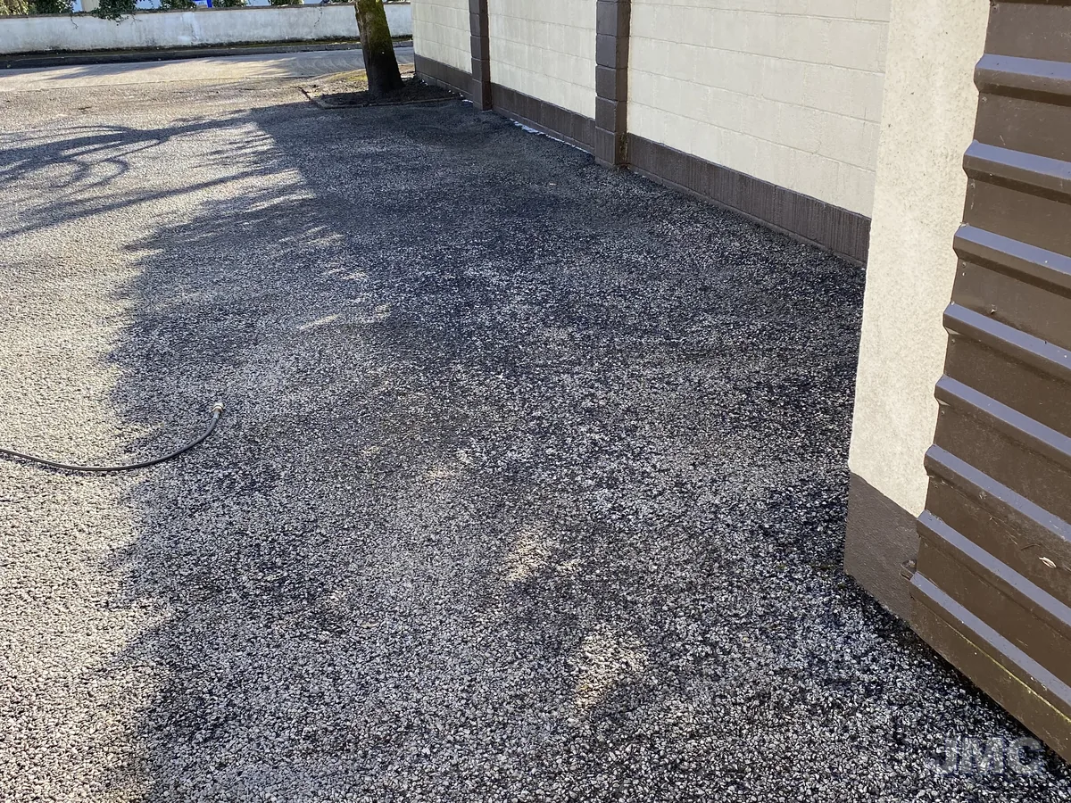 After: Moss-covered gravel drive, back to clean stone