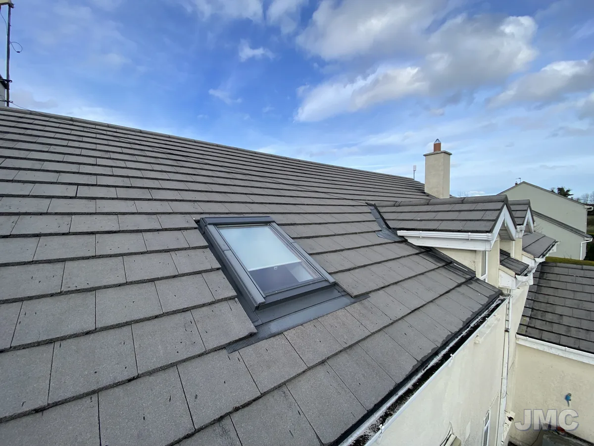 After: Tiled roof with a roof window, moss cleared