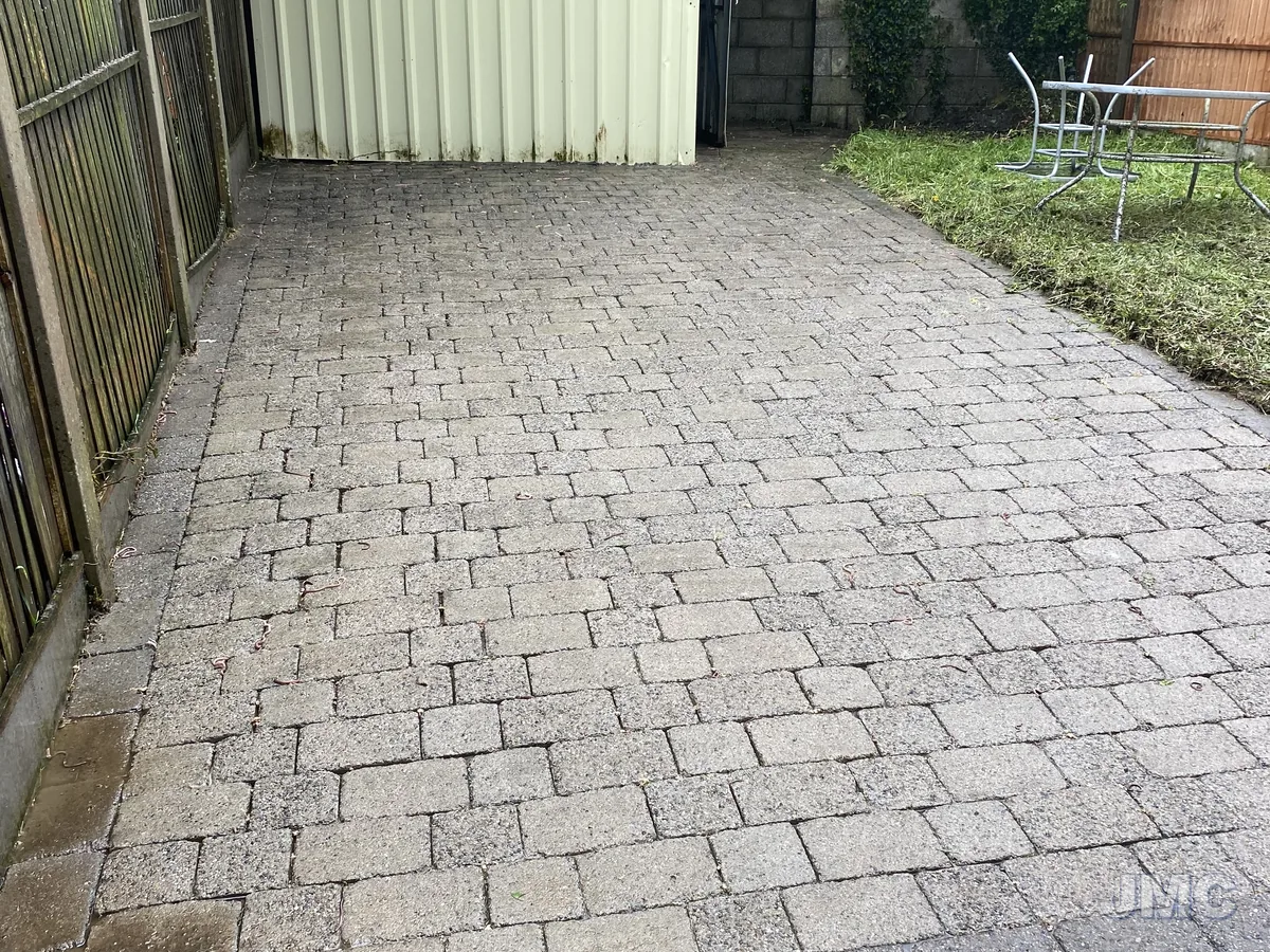 After: Cobble patio uncovered from the moss