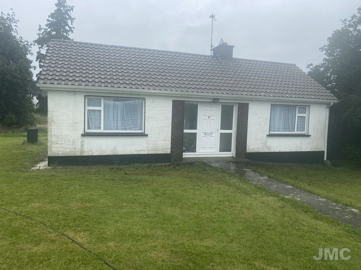 Before: Bungalow repainted, roof coated