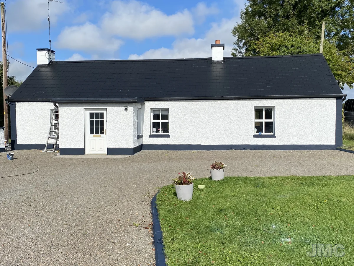 After: Cottage washed, roof coated and walls repainted