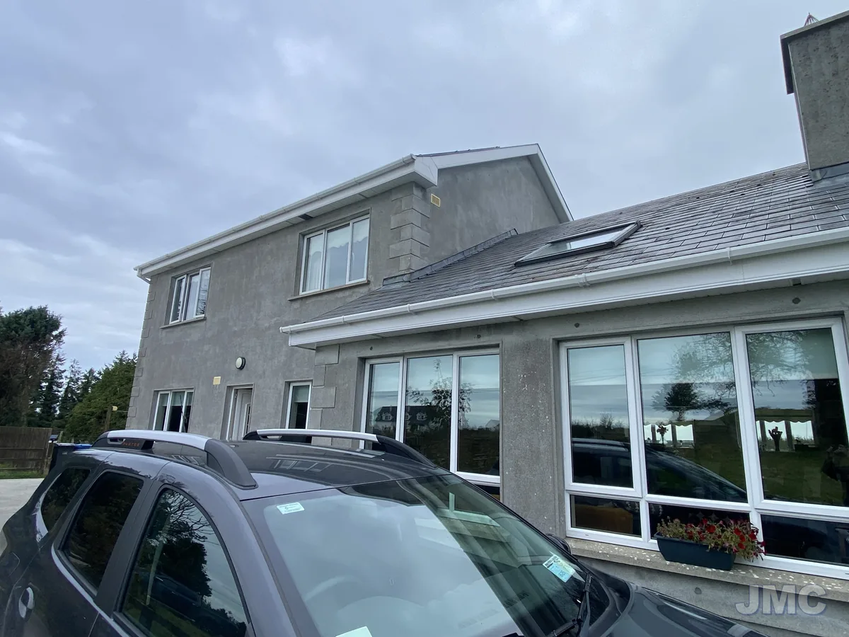 After: Red algae removed from a rendered house