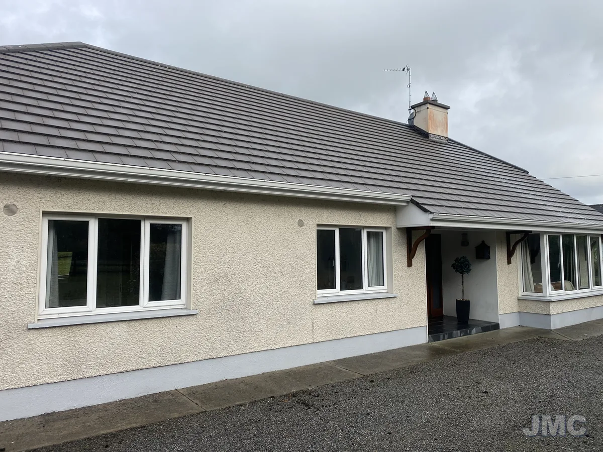 After: Bungalow roof and render washed