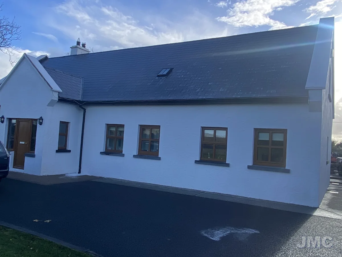 After: Dormer house, roof and walls washed