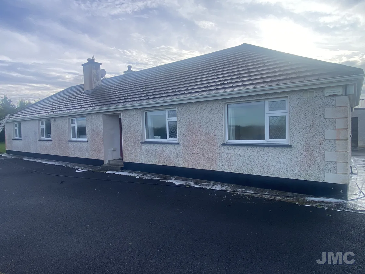 Before: Bungalow front, fascia and walls cleaned