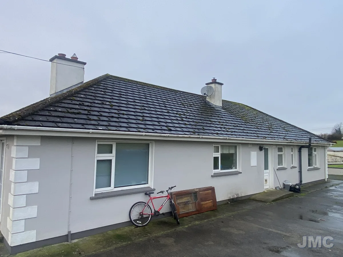 Before: House front washed, gutters cleared