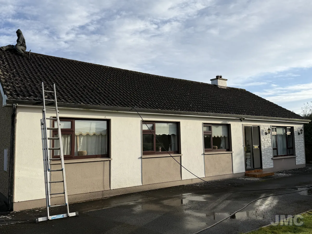 Before: Bungalow roof and walls cleaned
