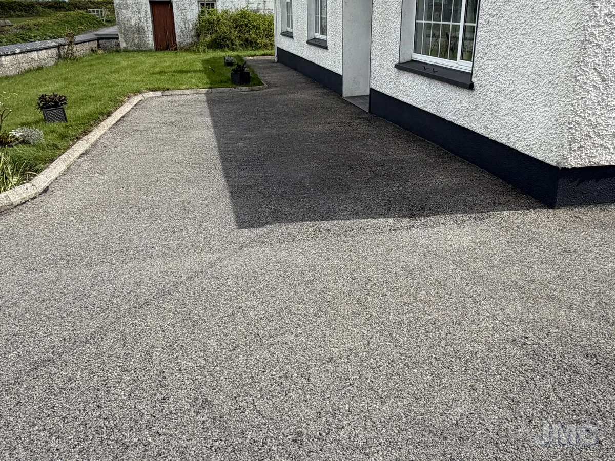 Before: Cottage front, tarmac washed