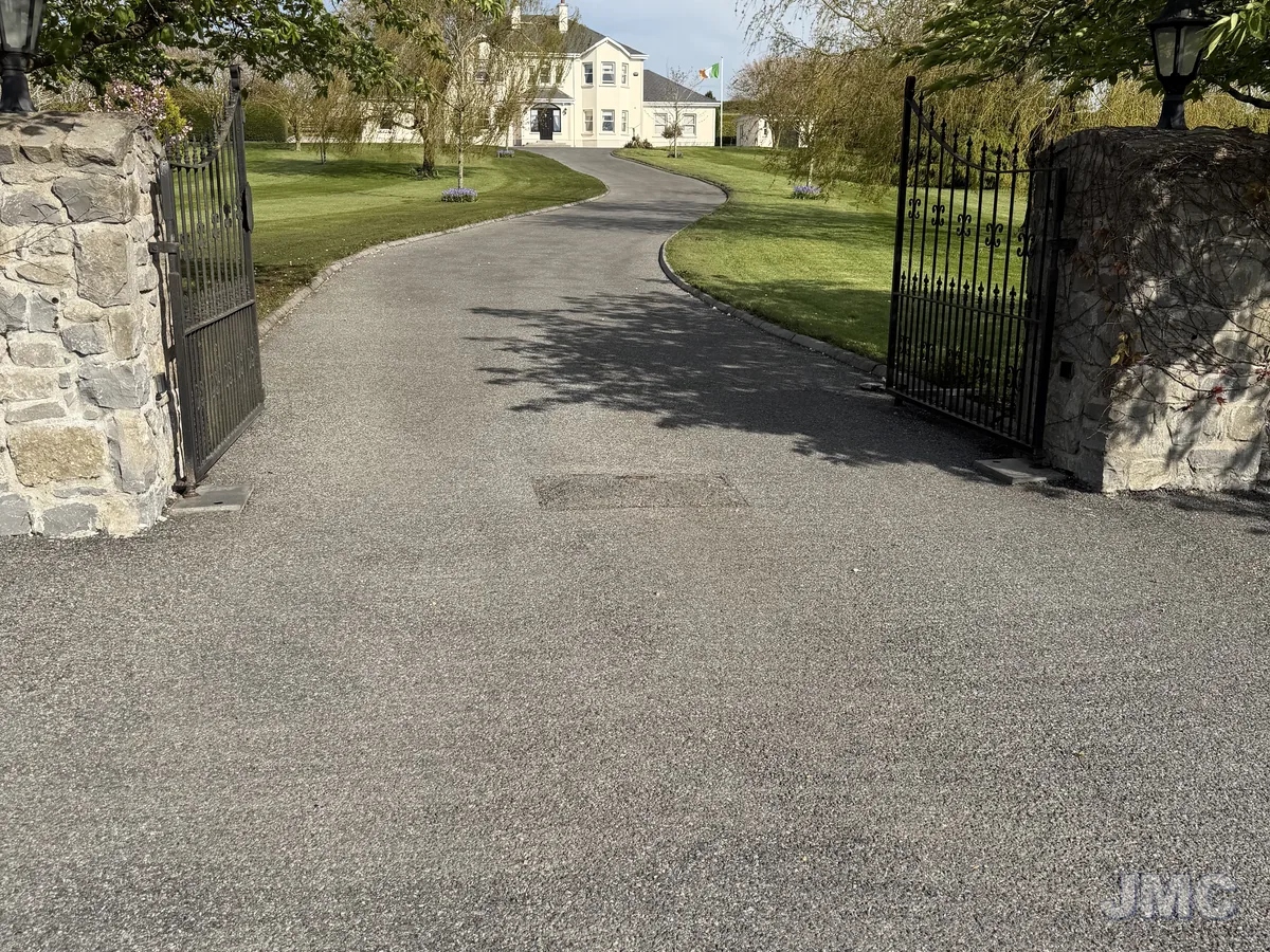 Before: Estate avenue between stone piers