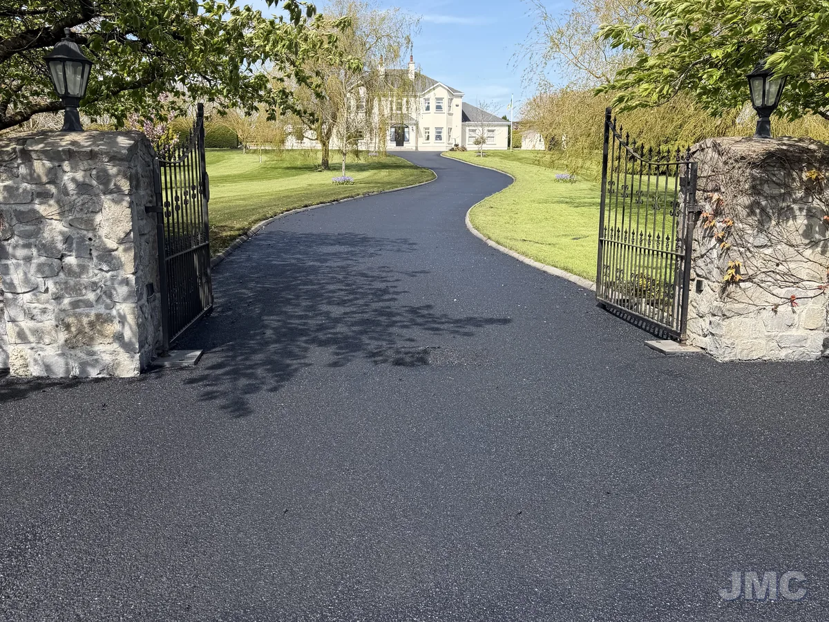 After: Estate avenue between stone piers