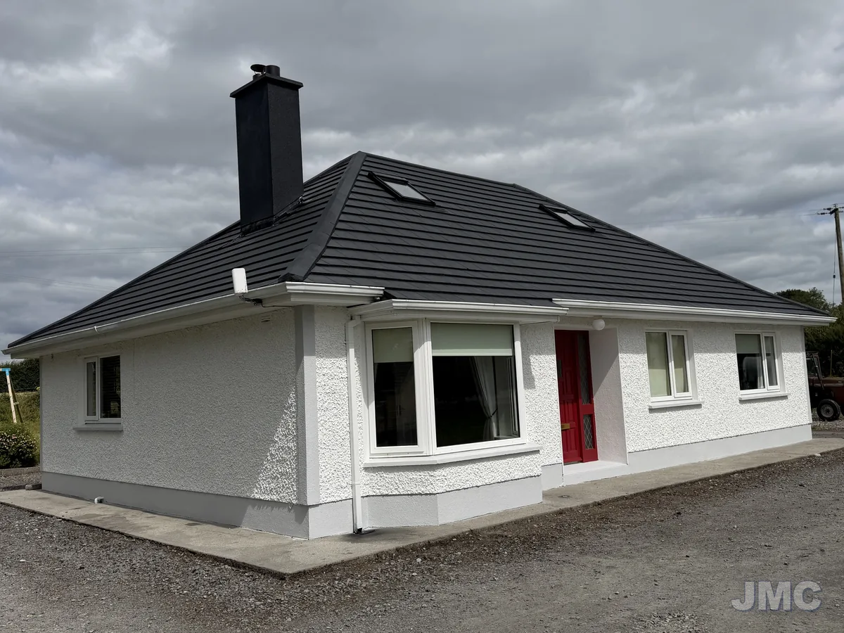 After: Bungalow, roof coated and walls painted
